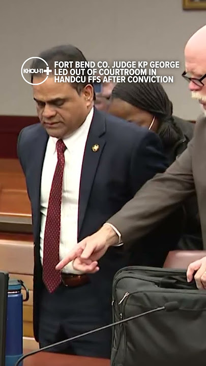 KP George saliendo esposado del tribunal en Fort Bend County